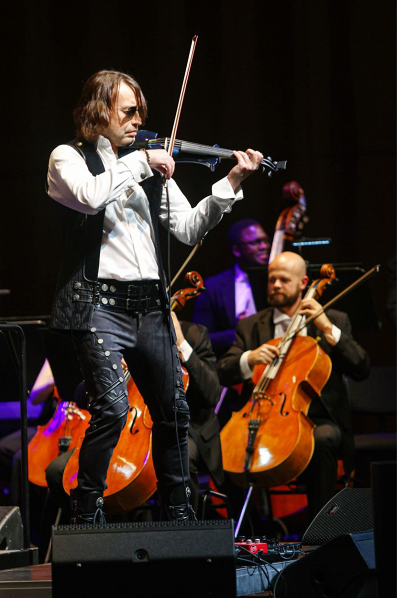 Paul Ya performing with violin